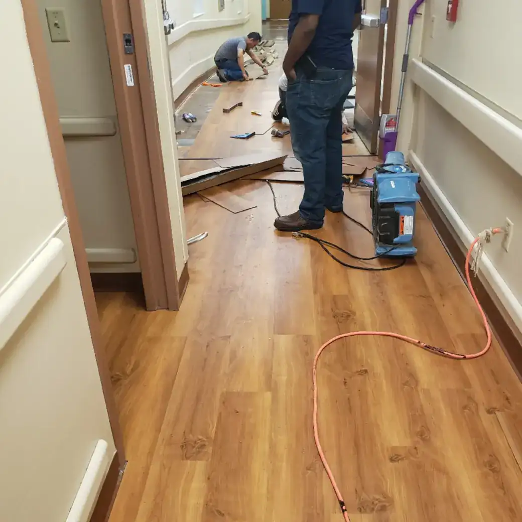 Commercial Flooring Contractor | Final Floors LLC Metro Atlanta Commercial wood-look plank flooring installation in progress in a Metro Atlanta facility corridor